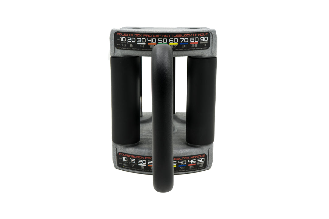 front view of powerblock pro series kettlebell handle showing padded grips and weights in 5 to 10 pound increments